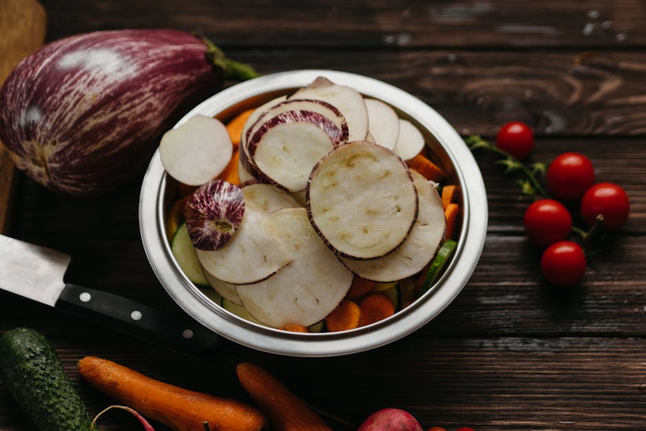 A vibrant assortment of fresh vegetables on a rustic wooden table. Perfect for healthy eating visuals.